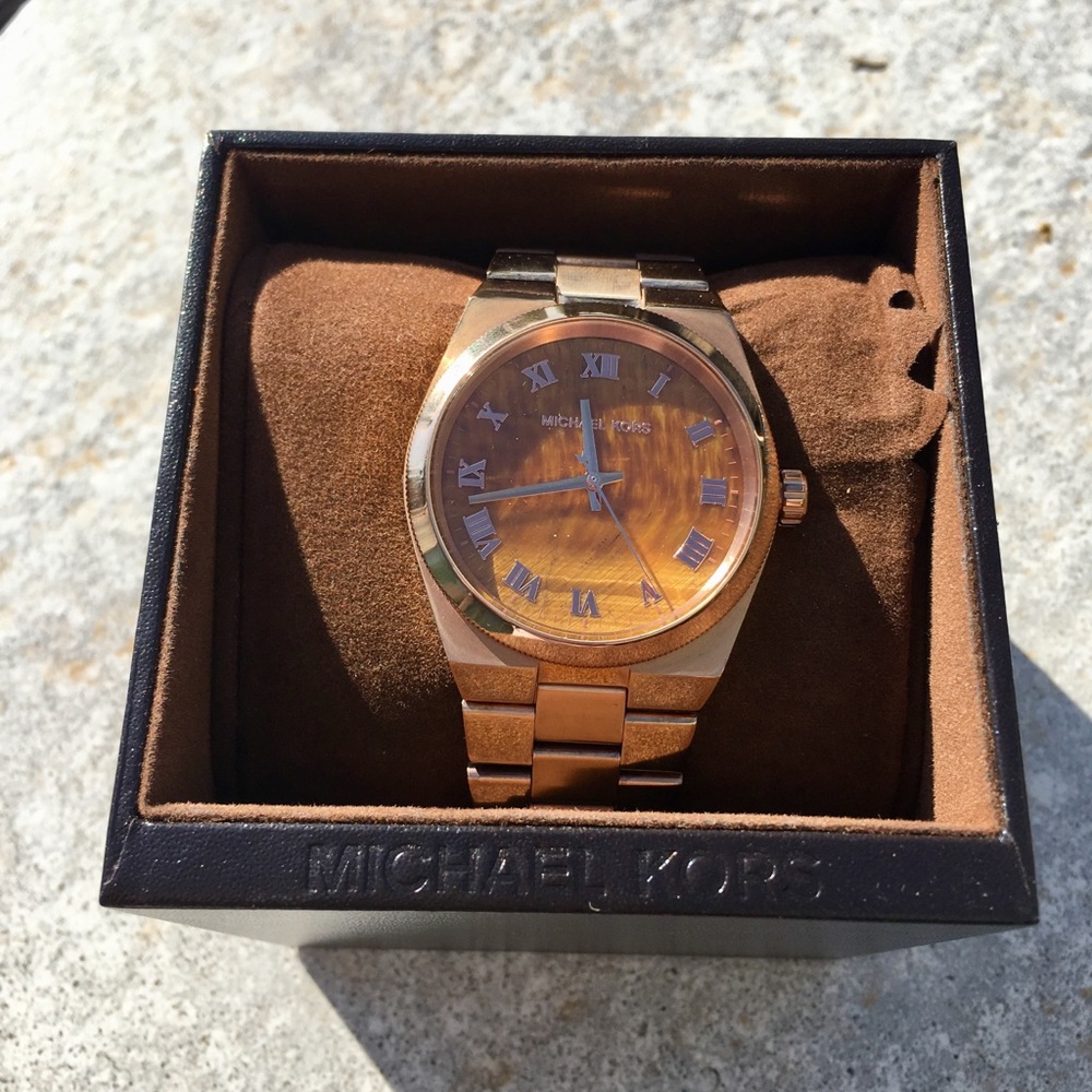 Michael Kors rose gold tigers eye watch face